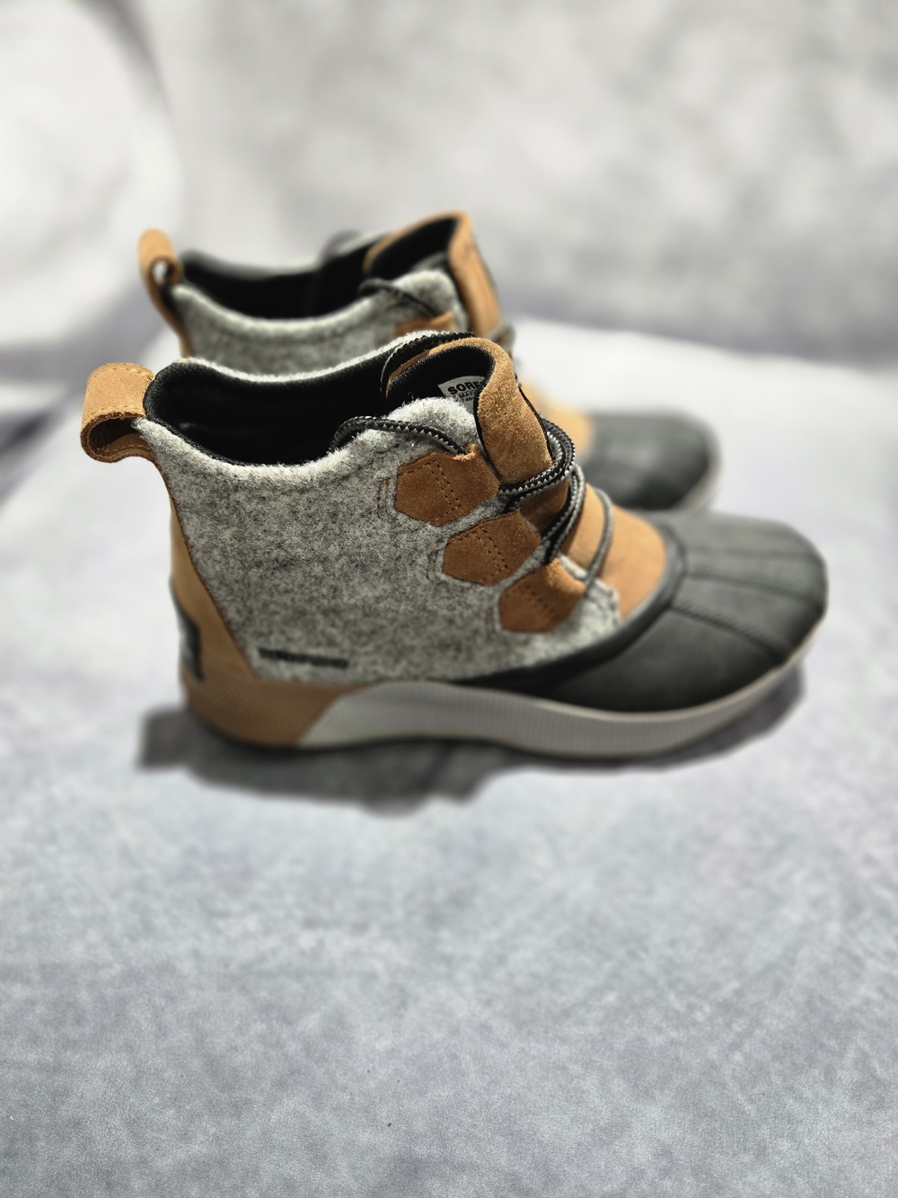 SOREL Out 'N About III Classic Waterproof Boot in the "Camel Brown/Black" colorw